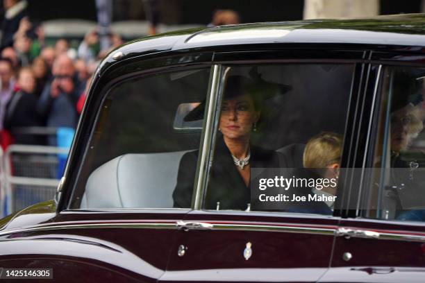 Catherine, Princess of Wales, Camilla, Queen Consort and Prince George of Wales are seen on The Mall ahead of The State Funeral for Queen Elizabeth...