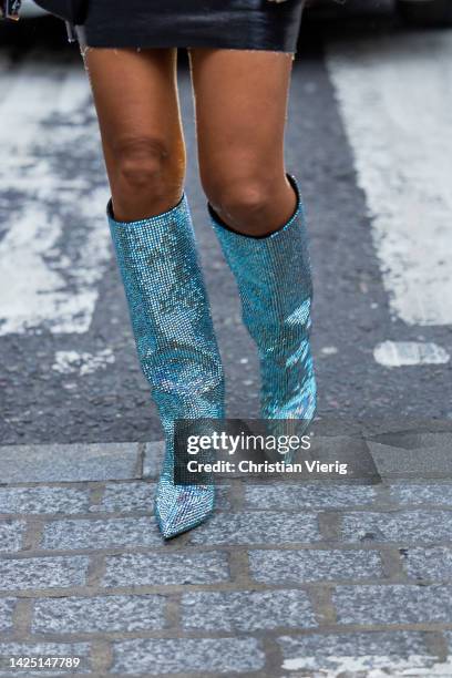 Tamara Kalinic wears glitter boots, black skirt, navy blazer, white button shirt, bag outside Erdem during London Fashion Week September 2022 on...