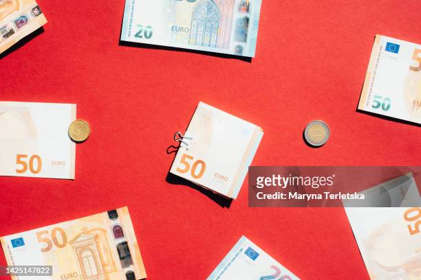 euro on a red background. money. currency. inflation. world crisis. - european union abstract stockfoto's en -beelden