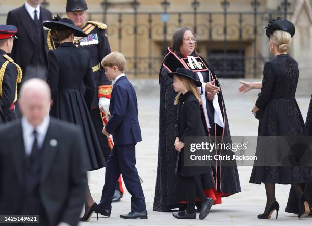 Catherine, Princess of Wales, Princess Charlotte of Wales and Prince George of Wales arrive at Westminster Abbey for The State Funeral of Queen...