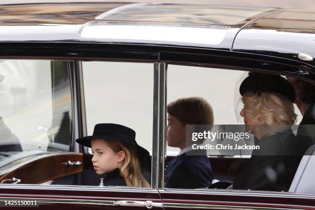 Princess Charlotte of Wales, Prince George of Wales, Camilla, Queen consort and Catherine, Princess of Wales are seen on The Mall ahead of The State...