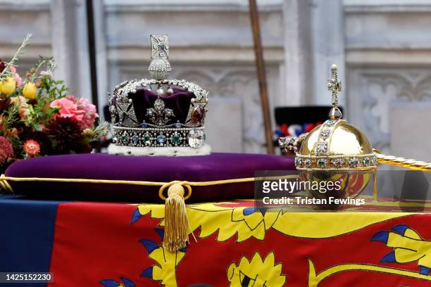 The coffin of Queen Elizabeth II with the Imperial State Crown, Orb and Sceptre resting on top is carried into Westminster Abbey on September 19,...