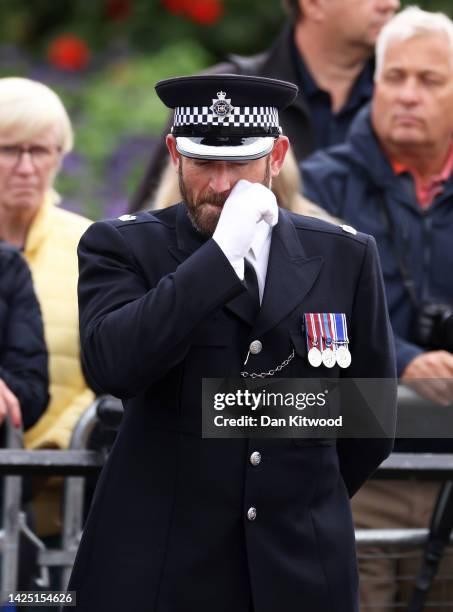 Police officer is seen at Westminster Abbey for the State Funeral of Queen Elizabeth II on September 19, 2022 in London, England. Elizabeth Alexandra...