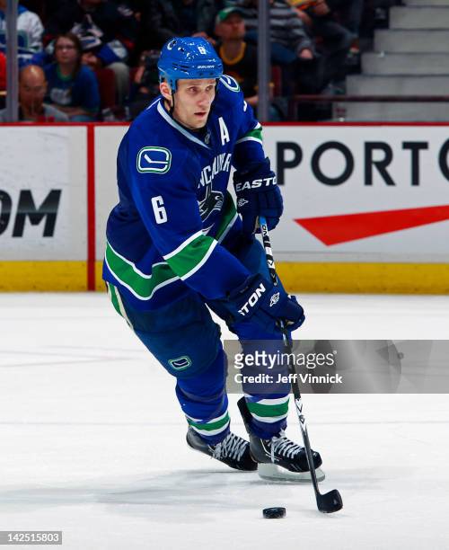 Sami Salo of the Vancouver Canucks skates up ice with the puck during their NHL game against the Calgary Flames at Rogers Arena March 31, 2012 in...