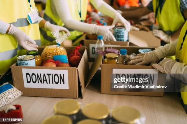 donation for poor people - food drive stock pictures, royalty-free photos & images