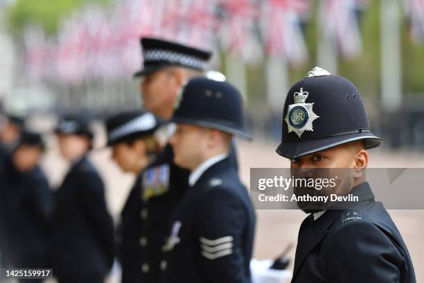 Police officer at The State Funeral of Queen Elizabeth II on September 19, 2022 in London, England. Elizabeth Alexandra Mary Windsor was born in...