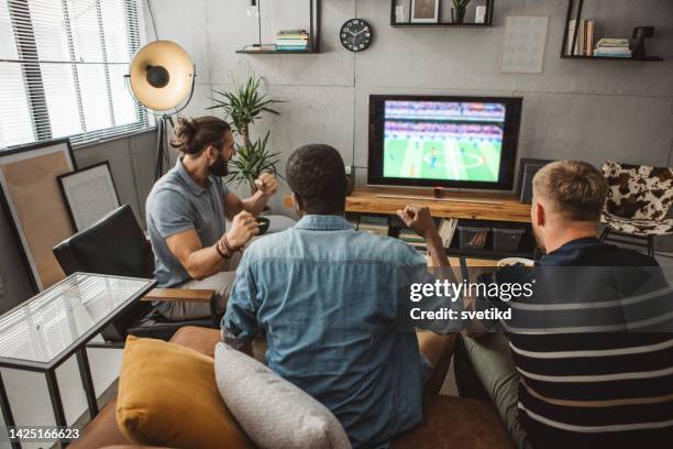 watching soccer championship at home - sunday league stock pictures, royalty-free photos & images