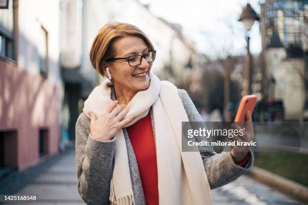 one beautiful senior woman outdoor - middle aged woman winter stock pictures, royalty-free photos & images