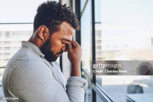 fail, stress and frustrated businessman at office window in depression, angry or sad mood. headache pain, burnout or anxiety corporate worker thinking of mistake, deadline or bad time management - zoom fatigue stock pictures, royalty-free photos & images