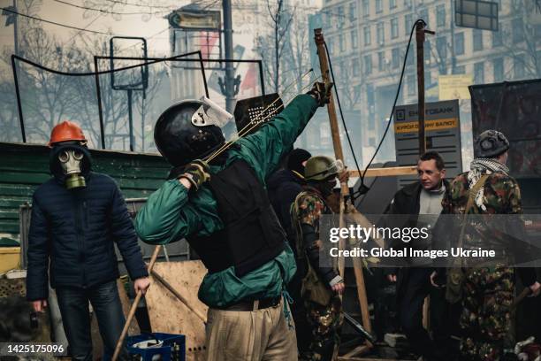 Protesters fighting government forces at barricades on Maidan Nezalezhnosti on February 19, 2014 in Kyiv, Ukraine. A wave of civil protests, known as...
