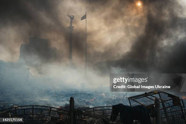 Smoke covers Maidan Nezalezhnosti during clashes between anti-government protesters and riot police on February 19, 2014 in Kyiv, Ukraine. A wave of...