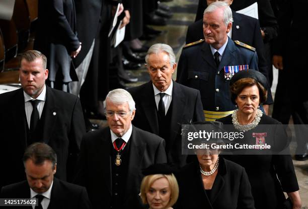 Former Prime Ministers of the United Kingdom, John Major and Tony Blair with his wife Cherie Blair depart Westminster Abbey after the funeral service...