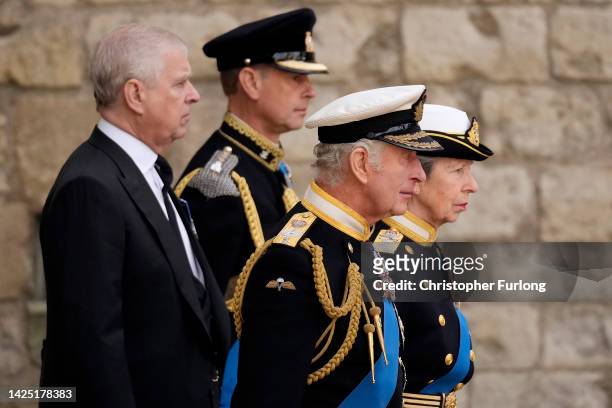 Prince Andrew, Duke of York, Prince Edward, Earl of Wessex, King Charles III and Anne, Princess Royal walk behind the Queen's funeral cortege borne...