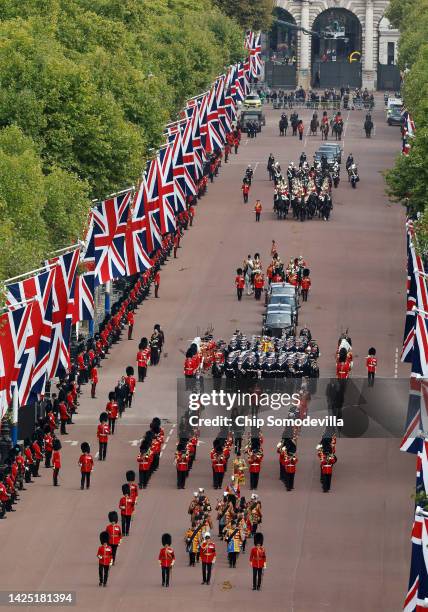 The Queen's funeral cortege borne on the State Gun Carriage of the Royal Navy travels along The Mall on September 19, 2022 in London, England....