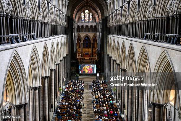 Mourners watch the live stream of the funeral of Her Majesty Queen Elizabeth II at Salisbury Cathedral, on September 19, 2022 in Salisbury, England....