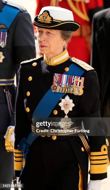 Anne, Princess Royal follows behind The Queen's funeral cortege borne on the State Gun Carriage of the Royal Navy on September 19, 2022 in London,...