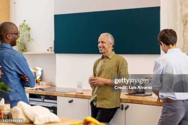 three businessman having coffee break at work - canteen stock pictures, royalty-free photos & images