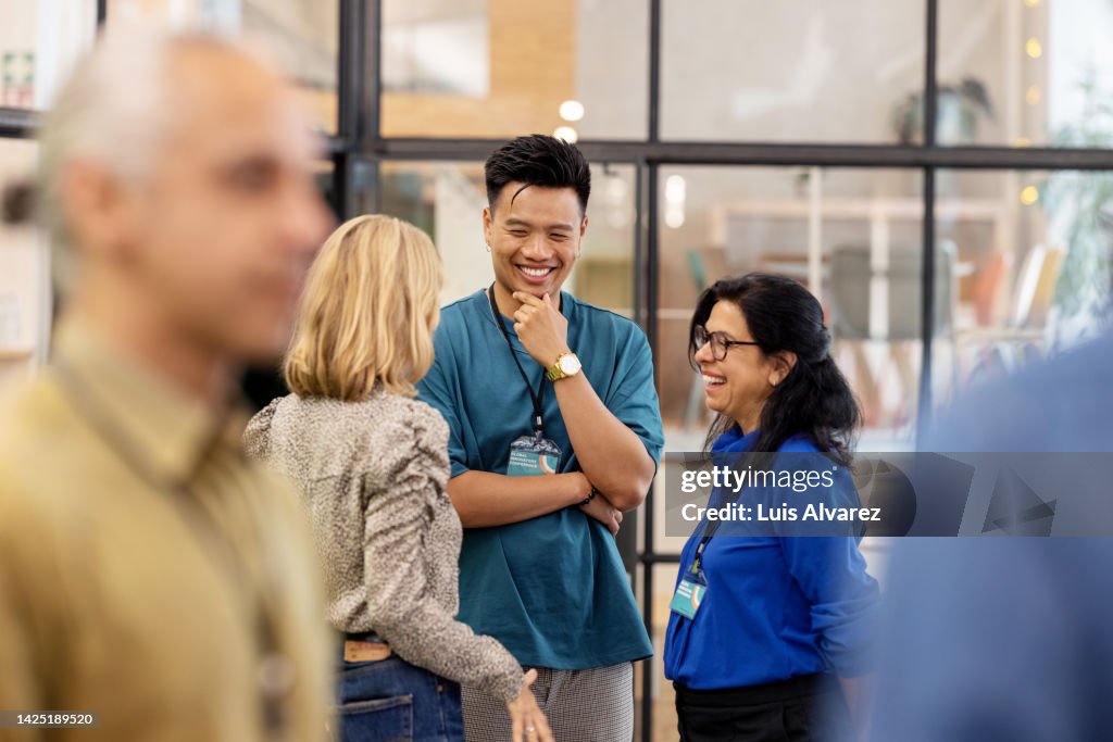 Multiracial business people talking before the seminar