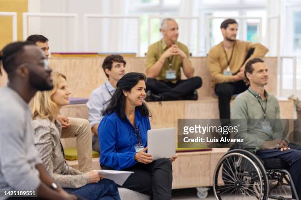 group of entrepreneurs attending a startup conference - workshop participant stock pictures, royalty-free photos & images