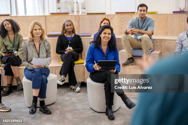 multiracial business people attending a startup conference - publicity event stockfoto's en -beelden