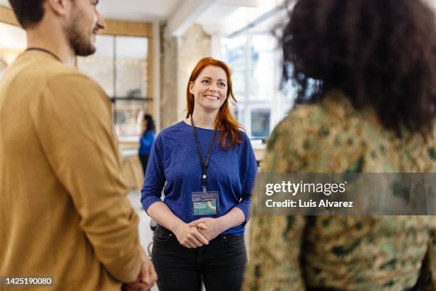 diverse business people talking at the seminar - real people office stock pictures, royalty-free photos & images