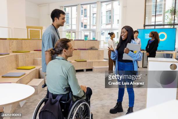diverse businesspeople talking in office during a conference - look of the day launch party stock pictures, royalty-free photos & images