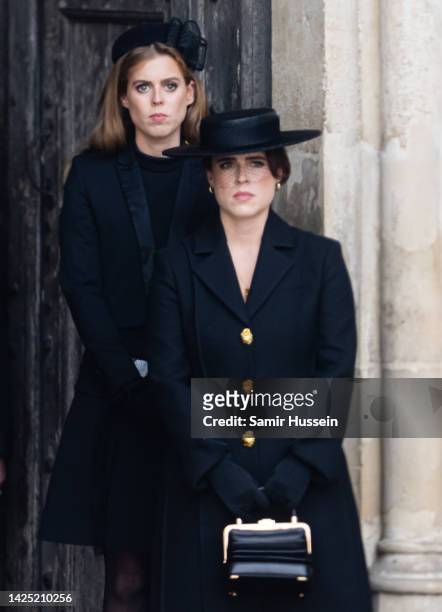 Princess Beatrice of York and Princess Eugenie of York during the State Funeral of Queen Elizabeth II at Westminster Abbey on September 19, 2022 in...