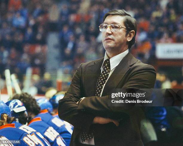 Head Coach Al Arbour of the New York Islanders follows the action from the bench Circa 1970 at the Montreal Forum in Montreal, Quebec, Canada.