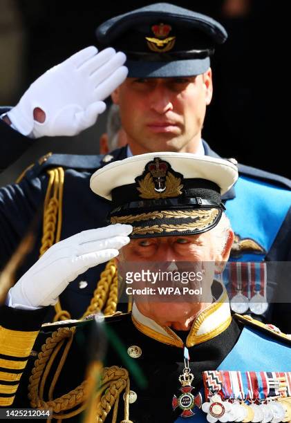 King Charles III and Prince William, Prince of Wales salute after the State Funeral of Queen Elizabeth II on September 19, 2022 in London, England....