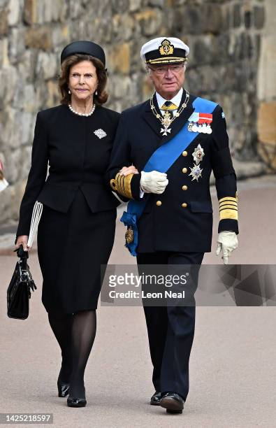 Queen Silvia of Sweden and Carl XVI Gustaf King of Sweden arrive at the Committal Service for Queen Elizabeth II at Windsor Castle on September 19,...