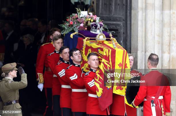 Queen Elizabeth's coffin is carried out of the doors of Westminster Abbey during The State Funeral Of Queen Elizabeth II at Westminster Abbey on...