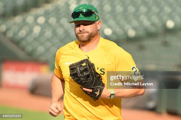 Stephen Vogt of the Oakland Athletics looks on during batting batting prior to a baseball game against the Baltimore Orioles at Oriole Park at Camden...