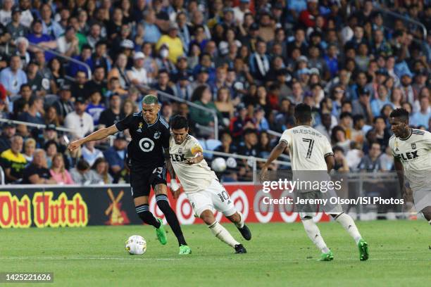 Kervin Arriaga of Minnesota United FC and Carlos Vela of LAFC battle for the ball during a game between Los Angeles FC and Minnesota United FC at...