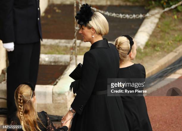 Zara Tindall, Lena Tindall, and Mia Tindall arrive at Windsor Castle for the Committal Service for Queen Elizabeth IIon September 19, 2022 in...