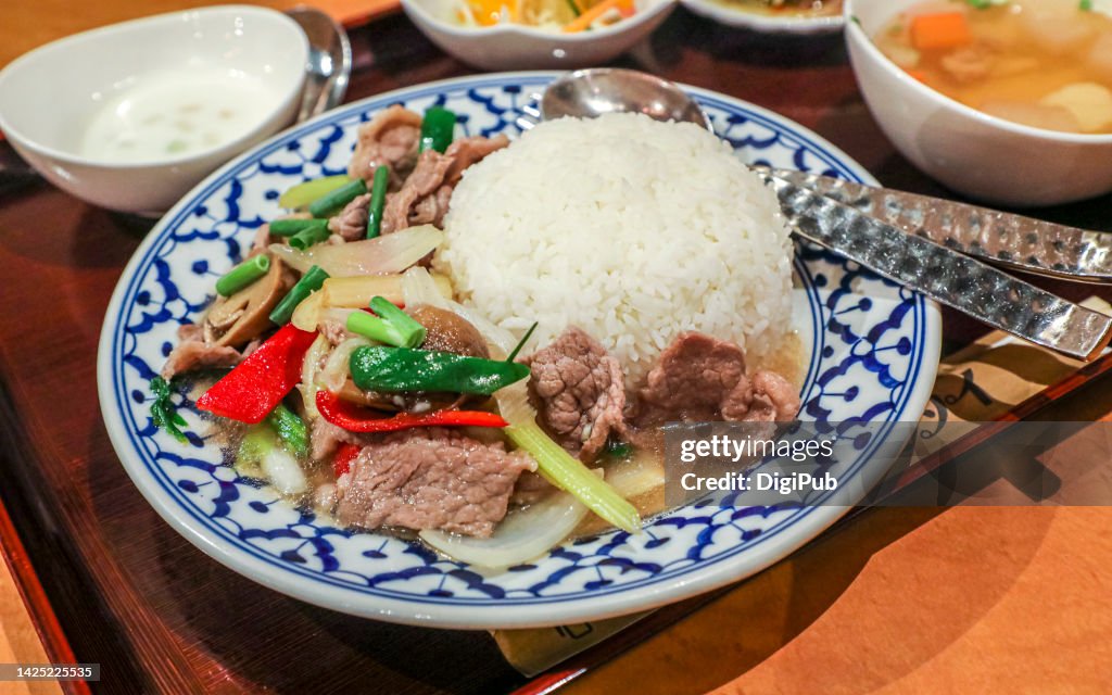 Beef and mushroom stir fried with oyster sauce on basmati rice set meal served at lunchtime