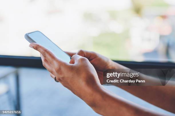 closeup of a woman on a phone networking on social or doing research on an internet website. girl typing a message or chatting on a mobile app or online with a modern smartphone and wifi. - contact us stock pictures, royalty-free photos & images