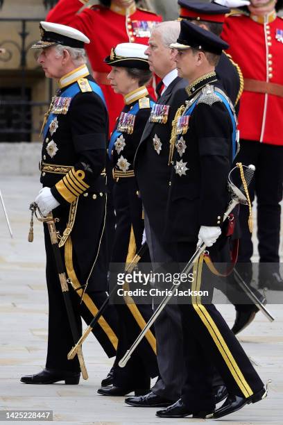 King Charles III, Anne, Princess Royal, Prince Andrew, Duke of York, and Prince Edward, Earl of Wessex arrive at Westminster Abbey for the State...