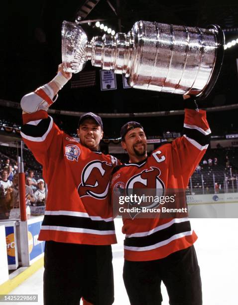 Jason Arnott and Scott Stevens of the New Jersey Devils celebrate the Stanley Cup victory in June 2000 in East Rutherford, New Jersey.
