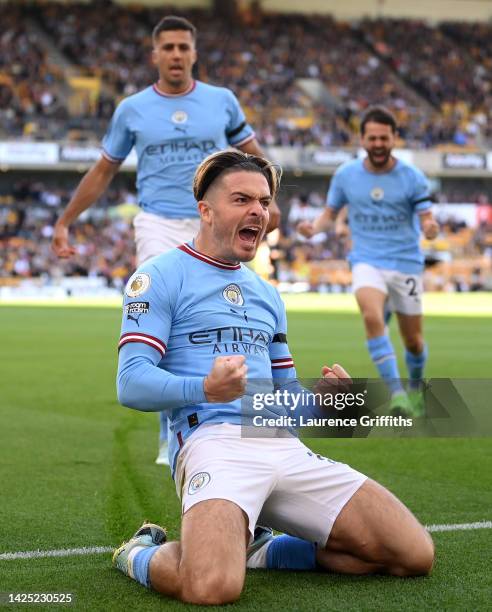 Jack Grealish of Manchester City celebrates scoring the first goal during the Premier League match between Wolverhampton Wanderers and Manchester...