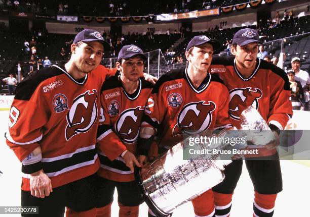 Igor Larionov, Sergei Brylin, Sergei Nemchinov and Vladimir Malakhov of the New Jersey Devils celebrate the Stanley Cup victory in June 2000 in East...