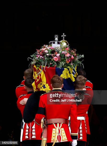 Pall bearers carry the coffin of Queen Elizabeth II into St. George's Chapel on September 19, 2022 in Windsor, England. The committal service at St...