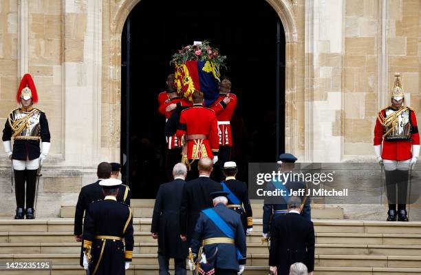 Pall bearers carry the coffin of Queen Elizabeth II with the Imperial State Crown resting on top into St. George's Chapel on September 19, 2022 in...