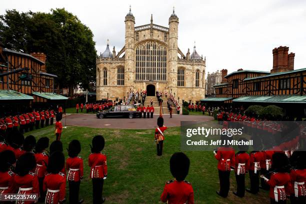 General view of the Grenadier Guards as the State Hearse carrying Queen Elizabeth II arrives at St. George's Chapel on September 19, 2022 in Windsor,...