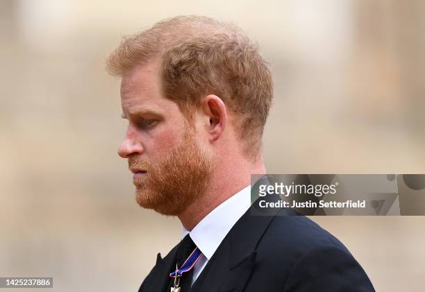 Prince Harry, Duke of Sussex as he joined the Procession following the State Hearse carrying the coffin of Queen Elizabeth II towards St George's...