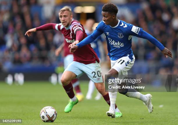 Demarai Gray of Everton beats Jarrod Bowen of West Ham United during the Premier League match between Everton FC and West Ham United at Goodison Park...