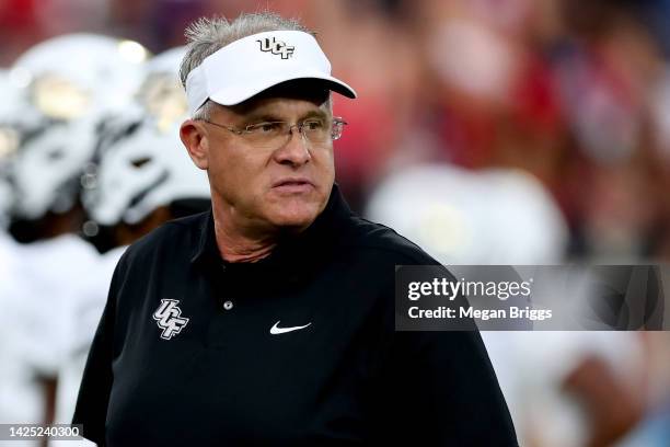 Head coach Gus Malzahn of the UCF Knights looks on during pregame warm-ups prior to a game against the Florida Atlantic Owls at FAU Stadium on...