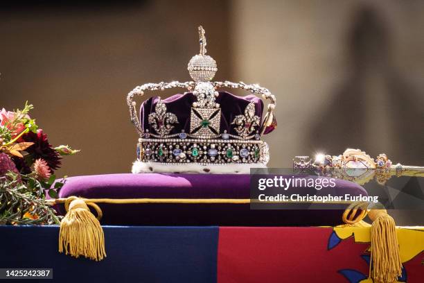 The coffin of Queen Elizabeth II with the Imperial State Crown resting on top, borne on the State Gun Carriage of the Royal Navy departs Westminster...