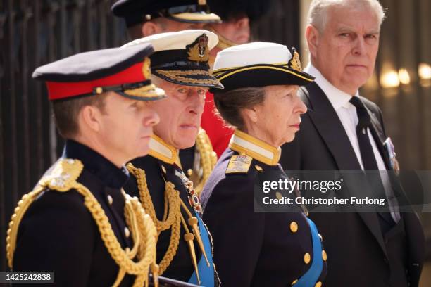 King Charles III, Anne, Princess Royal and Prince Andrew, Duke of York watch on as The Queen's funeral cortege borne on the State Gun Carriage of the...