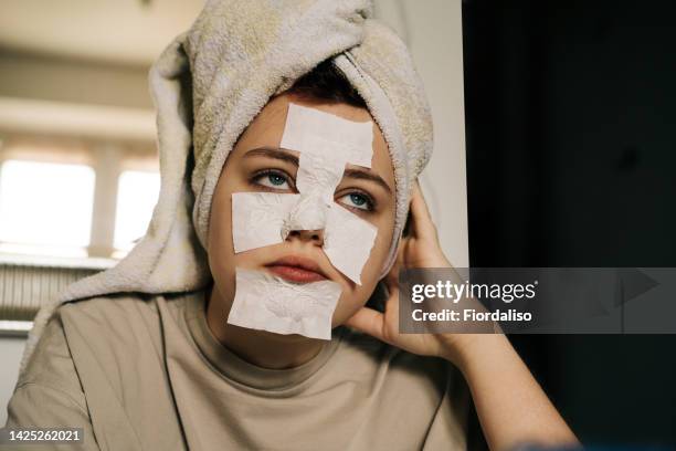 close-up portrait of a young teenage girl with a headband - nose mask fotografías e imágenes de stock