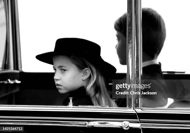 Princess Charlotte of Wales and Prince George of Wales arrive at The State Funeral Of Queen Elizabeth II at Westminster Abbey on September 19, 2022...